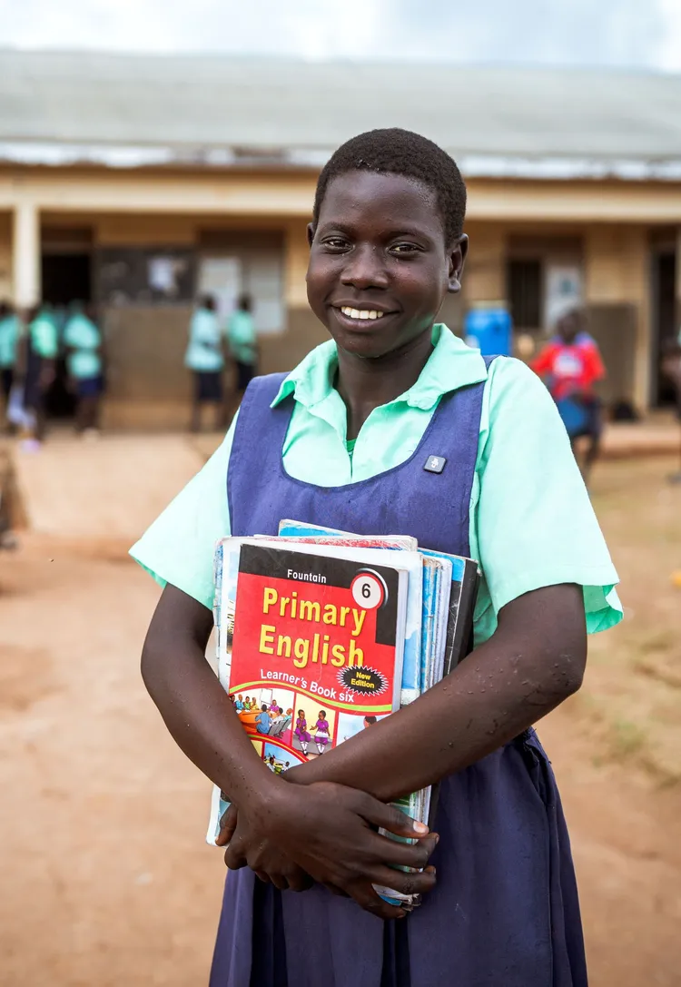 Margarel Aol, outside her school in Amuru District, Uganda